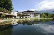 Natural bathing lake at the spa hotel Der Brandstetterhof in Stans, Tyrol